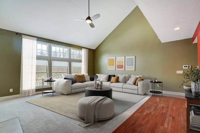 living room featuring ceiling fan and high vaulted ceiling