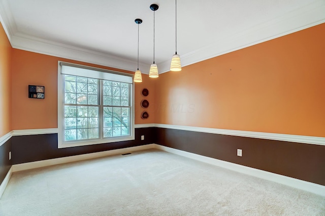 carpeted empty room featuring ornamental molding