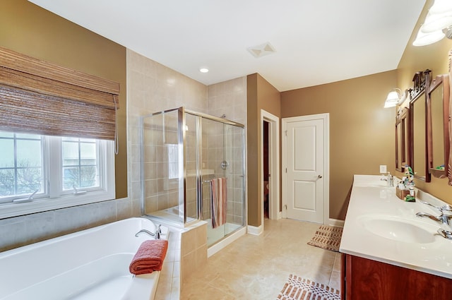 bathroom with tile patterned floors, vanity, and plus walk in shower