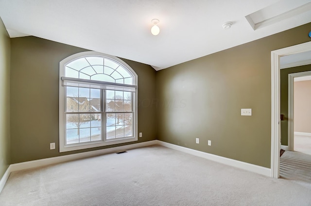 empty room featuring light colored carpet