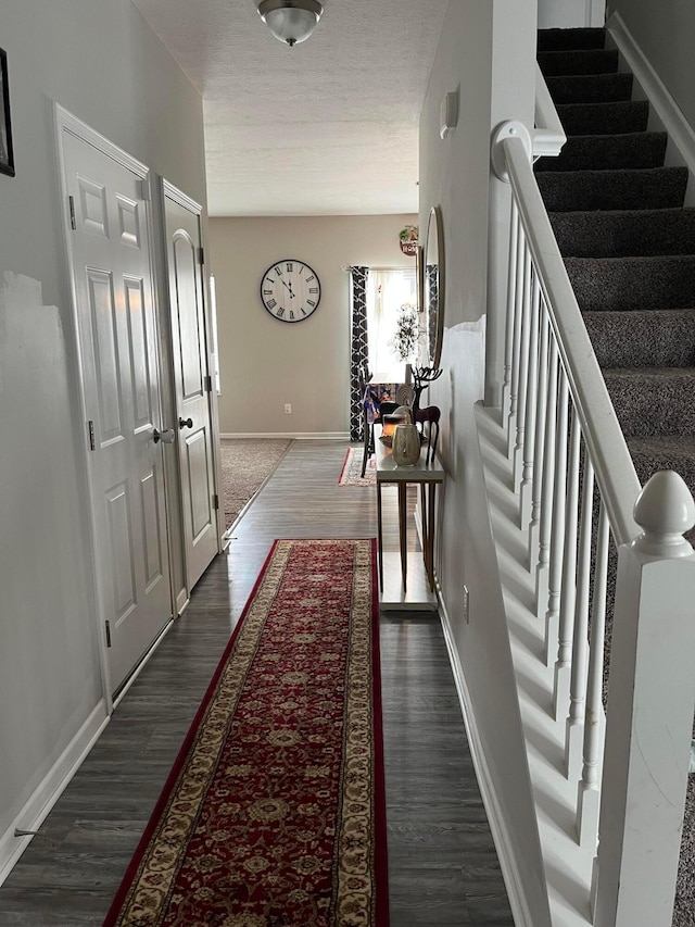 hallway featuring dark hardwood / wood-style flooring