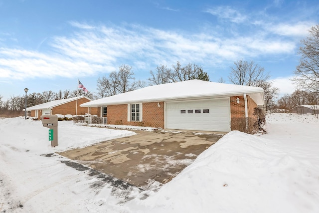 ranch-style home featuring a garage