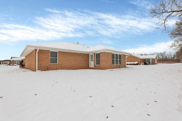 view of snow covered house