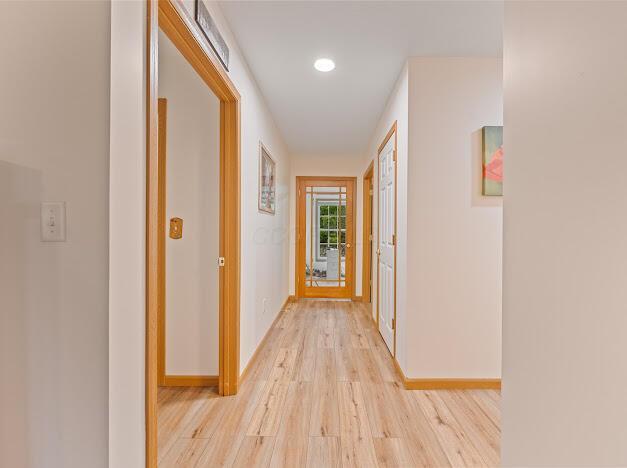 corridor featuring light hardwood / wood-style flooring