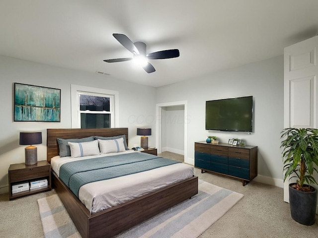 carpeted bedroom with ceiling fan