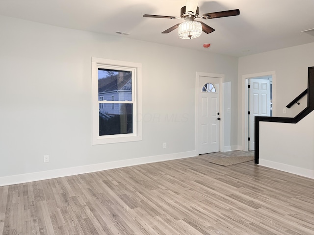 foyer featuring ceiling fan and light wood-type flooring