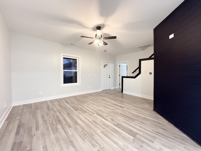 interior space with light wood-type flooring and ceiling fan