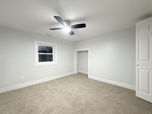 unfurnished bedroom with ceiling fan and carpet flooring