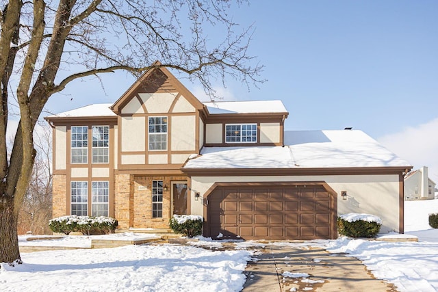 tudor home featuring a garage