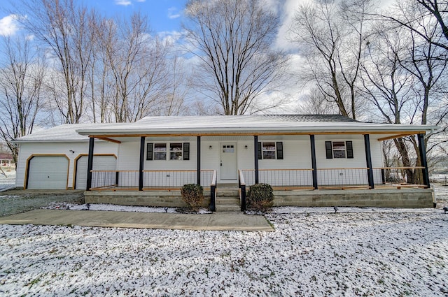 view of front of house with a porch and a garage