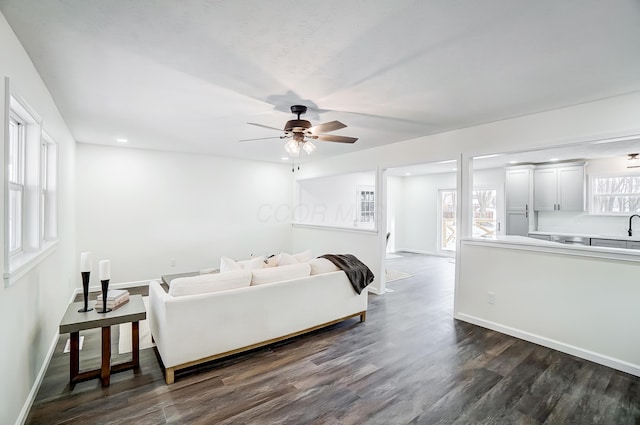 bedroom featuring ceiling fan and dark wood-type flooring