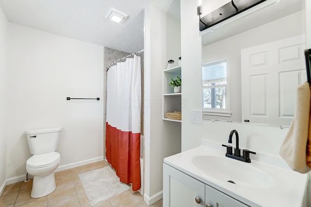 full bathroom featuring tile patterned floors, shower / bath combo with shower curtain, vanity, and toilet