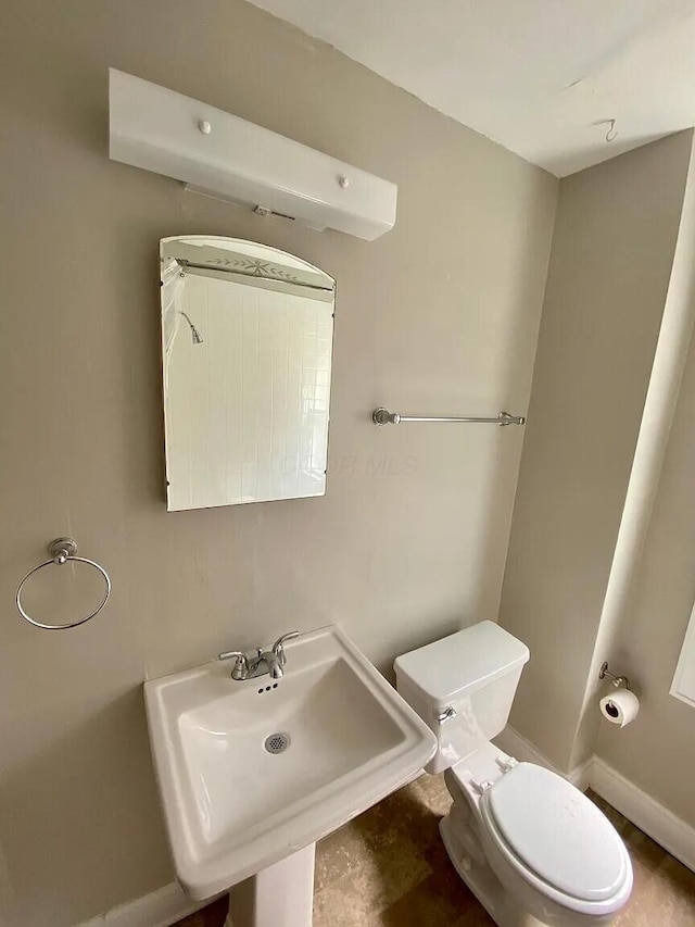 bathroom with toilet and sink