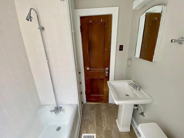 full bathroom featuring shower / tub combination, toilet, and sink