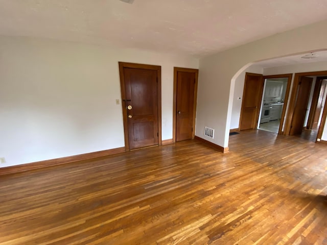 spare room with wood-type flooring