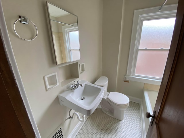 bathroom with toilet and sink