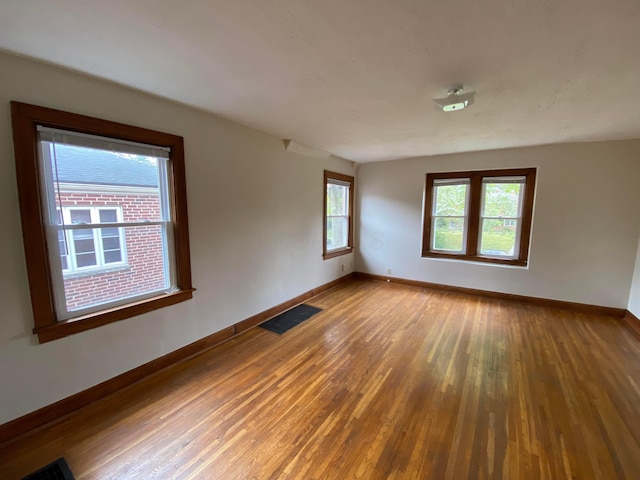 empty room featuring wood-type flooring