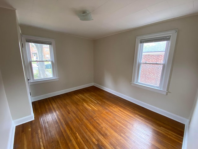 empty room featuring dark hardwood / wood-style flooring