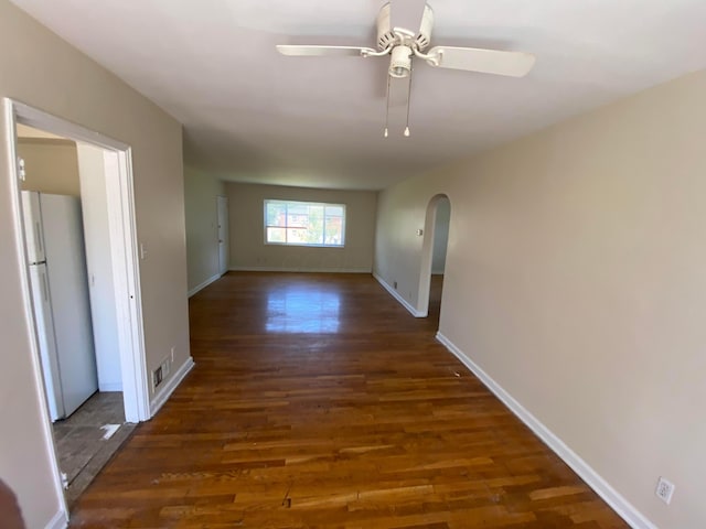 corridor with dark hardwood / wood-style flooring