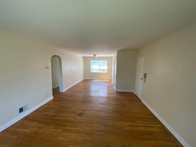 unfurnished room featuring dark hardwood / wood-style floors