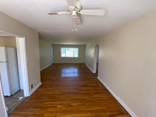 hallway with dark hardwood / wood-style flooring