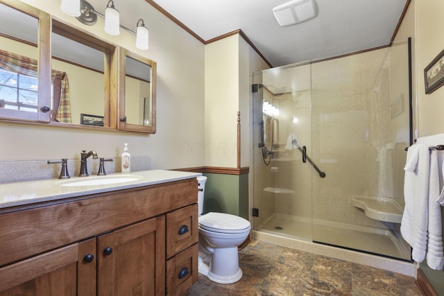 full bath featuring crown molding, toilet, a stall shower, stone finish flooring, and vanity