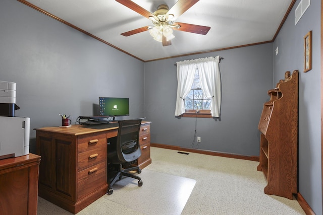 home office with ornamental molding, a ceiling fan, visible vents, and baseboards