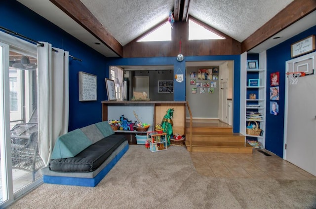 interior space featuring carpet, lofted ceiling with beams, and a textured ceiling