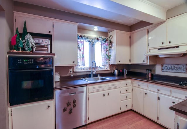 kitchen featuring white cabinets, sink, stainless steel dishwasher, black oven, and stovetop