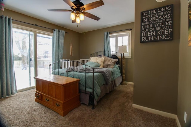 bedroom with carpet flooring, multiple windows, access to outside, and ceiling fan