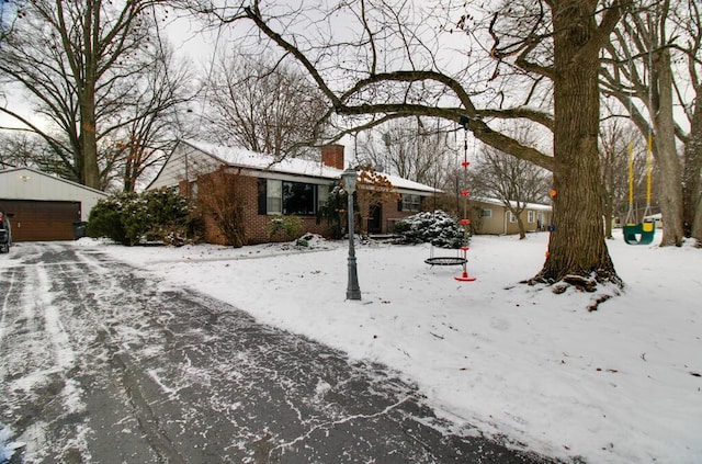 view of front of house with an outbuilding and a garage