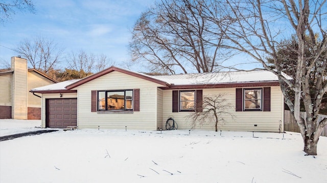 ranch-style home with a garage