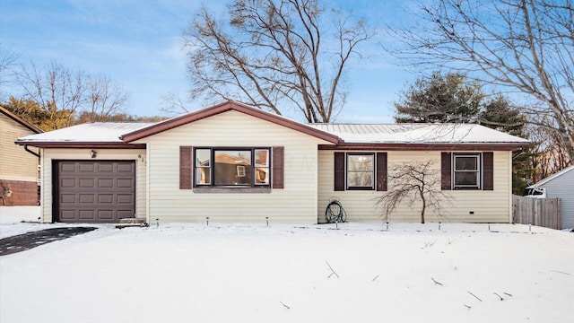 ranch-style home with a garage