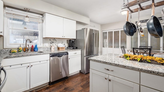 kitchen featuring white cabinets, dark hardwood / wood-style flooring, sink, and appliances with stainless steel finishes