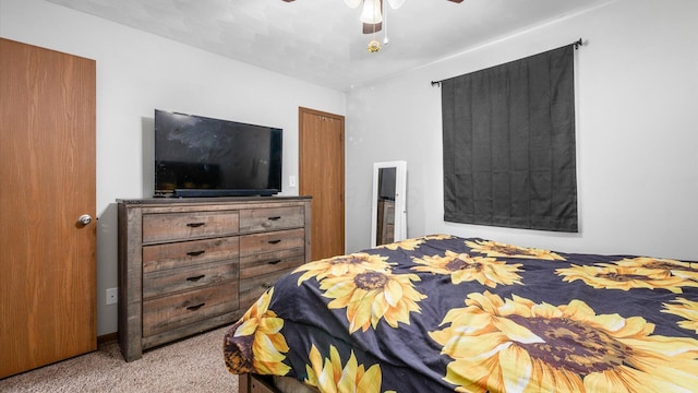 bedroom with ceiling fan and light carpet