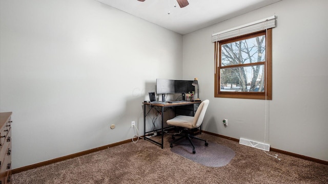 carpeted home office with ceiling fan