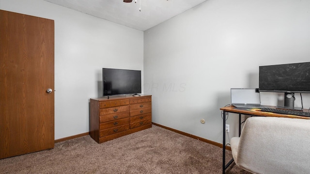 office space with ceiling fan, light colored carpet, and lofted ceiling