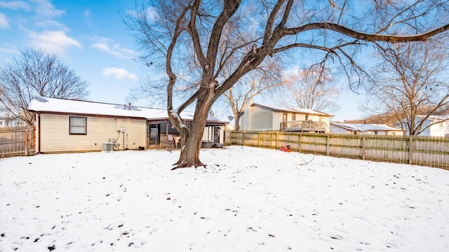 yard covered in snow with central AC unit