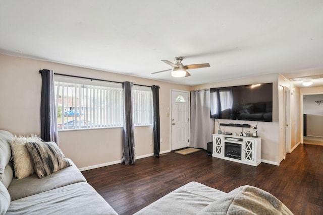 living room with dark hardwood / wood-style floors and ceiling fan