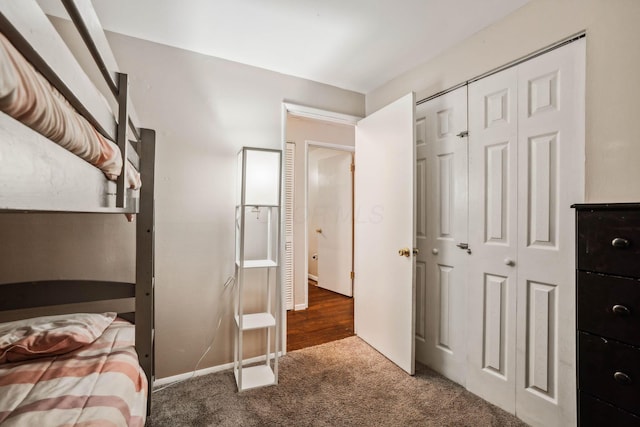 carpeted bedroom featuring a closet