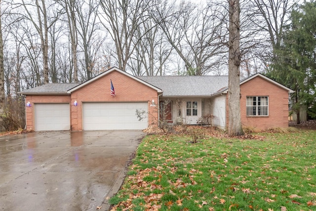 ranch-style home with a front lawn and a garage