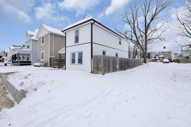 view of snow covered house