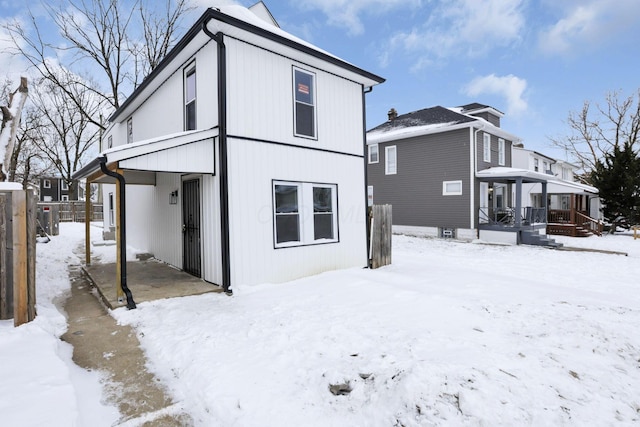 view of snow covered house