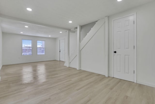 spare room featuring light hardwood / wood-style floors