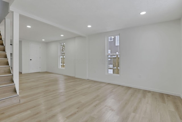 empty room with light hardwood / wood-style flooring