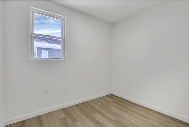 spare room with light hardwood / wood-style floors