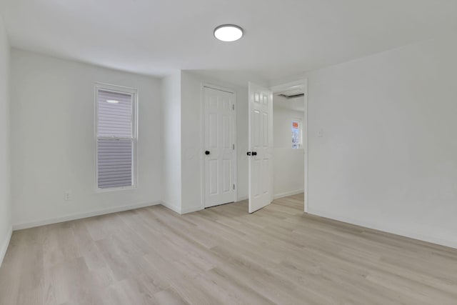 spare room featuring light hardwood / wood-style floors