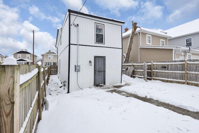 view of snow covered house