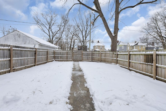 view of yard layered in snow