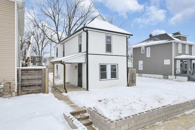 view of snow covered house